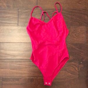 Women’s pink body suit